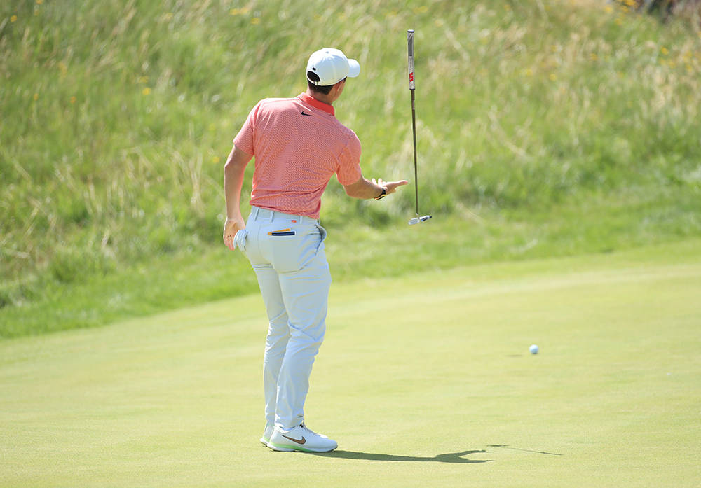 Rory McIlroy throwing his putter